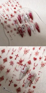 Gothic nail stickers featuring dark red spiders, crosses, and chain patterns on stiletto nails