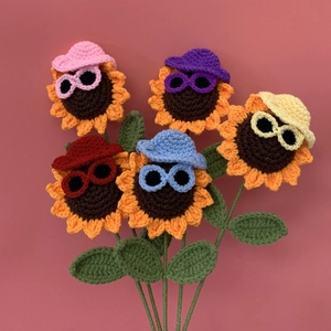 Handmade crochet sunflower bouquet with funny hats and sunglasses for home decoration