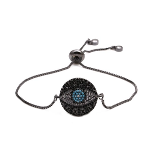 Detail of Turkish Evil Eye bracelet with gun black chain and blue stone inlay