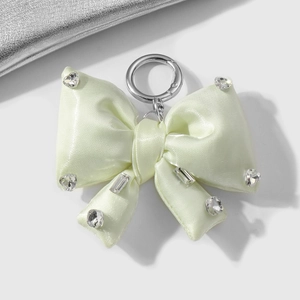 Pale green satin bow keychain with shimmering rhinestones and metal spring clasp