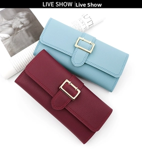 Close-up of litchi texture PU leather long wallets with golden buckle and flap design