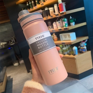 Close-up of pink 530ml stainless steel insulated bottle with matte finish and carry loop