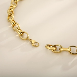 Golden chunky heart chain bracelet with pave diamonds and secure lobster clasp closure