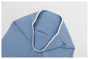 Detail of blue yoga set with contrast white piping and high-quality flatlock stitching