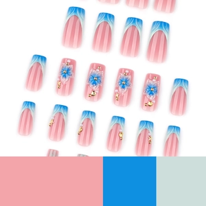 Blue French press-on nails with 3D floral designs and marine shell charms, long coffin shape