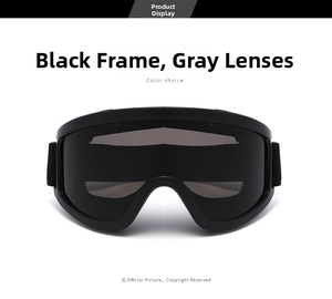 Detail of outdoor goggles featuring a matte black frame and dark grey lenses with elastic strap