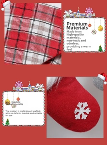 Detail of Christmas stocking with red plaid fabric, white faux fur and snowflake embroidery