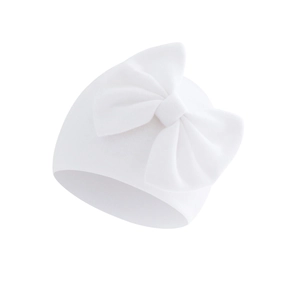 Detail of soft ribbed cotton baby hat featuring a large decorative double bow in white