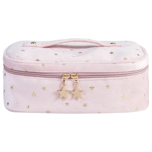 Pink velvet makeup bag with gold star patterns and a top handle on white background
