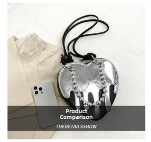 Close-up of heart-shaped handbag featuring fluid silver texture and elegant beaded chain
