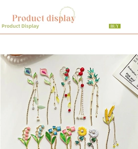 Detailed display of vintage enamel hairpins with floral patterns and pearl tassels
