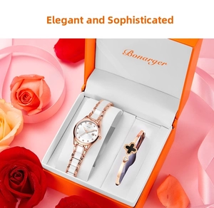 Coffret montre or rose pour femme et bracelet trèfle dans une élégante boîte orange