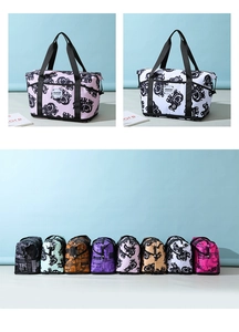Detail view of large capacity travel bags with diverse elephant prints and patterns