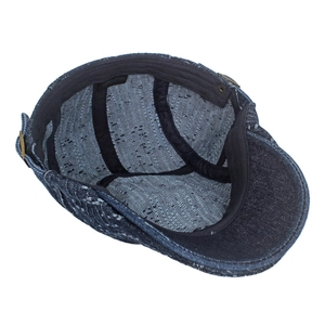 Inside view of adjustable cotton newsboy cap with jacquard texture and 100% cotton label