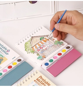 Detail of portable watercolor book with 8-color palette and 20 ocean-themed sheets
