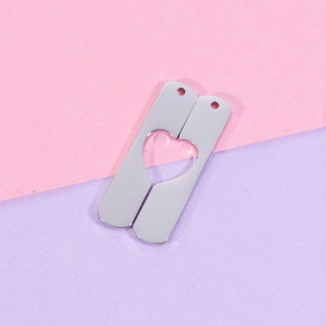 Polished stainless steel heart puzzle pendant set with mirror finish and cutout detail