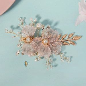 Handmade bridal hair clip with pink mesh flowers and gold leaf accents for weddings