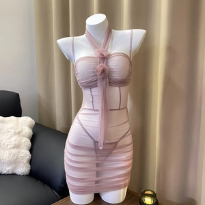 Sexy pink sheer mesh mini dress with halter neck and floral detail on a white mannequin