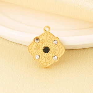 Macro view of French vintage rhombus pendant with four rhinestones and a black gemstone