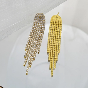 Detailed view of the gold mesh backing and needle pin on long tassel rhinestone earrings