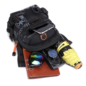 Detailed top view of tactical waist bag capacity showing EDC items on white background
