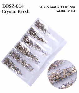 Macro view of 1440pcs AB iridescent flatback nail crystals in clear six-grid packaging