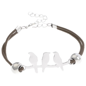 Detail of hummingbird charm bracelet with dark brown cords and silver metallic accents
