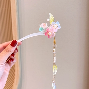 Detail of ancient style hair stick featuring resin flowers and elegant pearl tassels