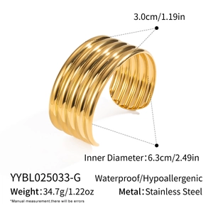 Detailed view showing a 3.0cm wide striped stainless steel cuff bracelet in gold finish