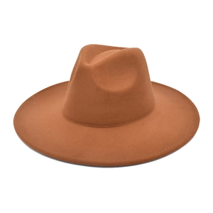 Macro side view of caramel wool fedora hat with wide flat brim and pinched crown