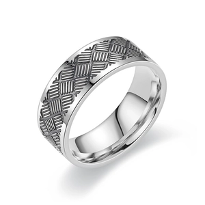 Detail shot of men's titanium steel ring featuring geometric grid engraving and polished inner