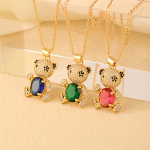 Three gold bear pendant necklaces with blue, green and red gemstones and white zircons