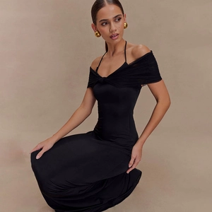 Elegant full-length view of the black off-shoulder mesh midi dress on a posing model