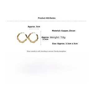Macro detail of gold twist hoop earrings with dimensions and material specifications
