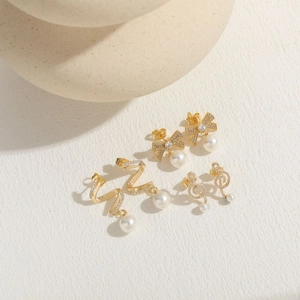 Golden pearl earrings set featuring zircon butterfly and musical note designs