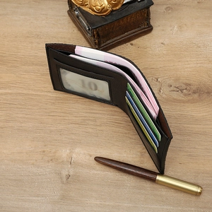 Interior detail of black leather bifold wallet with card slots and bill compartment