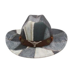Detail of patchwork denim fedora hat with brown leather band and metal bull head emblem