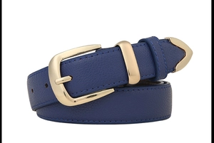 Macro detail of dark royal blue lychee texture leather belt with golden metal buckle