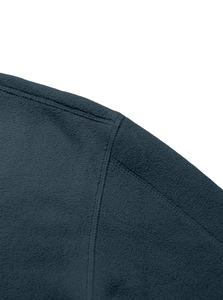 Detailed close-up of high-density stitching on navy blue fleece fabric shoulder seam