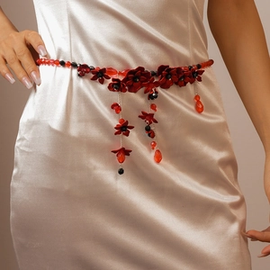 Chic red acrylic beaded flower waist chain with teardrop pendant on champagne satin dress