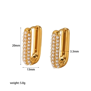 Detail view of gold rectangular earrings with pearl inlay showing 20mm x 13mm dimensions