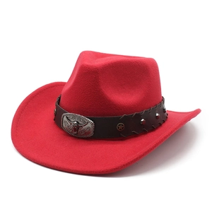 Close-up of red wool felt cowboy hat featuring leather band with star studs and bull head buckle