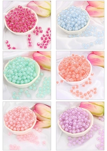 Detailed grid of colorful acrylic beads in pastel tones for DIY jewelry making