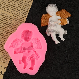 Pink silicone angel mold with wing detail and finished cupid resin statue figurine