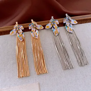 Vintage leaf earrings with enamel finish, rhinestones, and long metal tassels