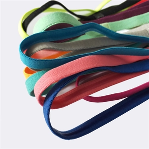 Macro shot of colorful elastic silicone non-slip headbands for yoga and running sports