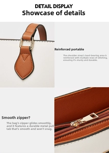Detail of reinforced stitching and smooth metal zipper on cross-pattern leather tote bag