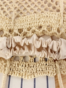 Handmade woven tote bag featuring natural straw texture and beige drawstring lining