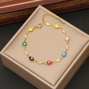 Detailed macro view of colorful evil eye beads and gold star charms on a delicate chain