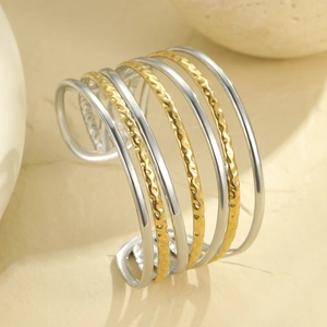Minimalist multi-layer geometric open cuff bracelet in textured gold and silver metal